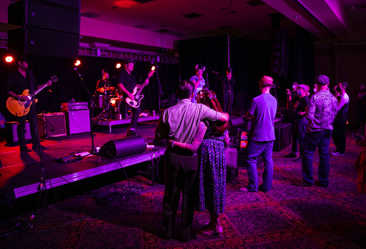 Attendees watch as Las Vegas band Shanda & the Howlers perform during the first day of Viva ...