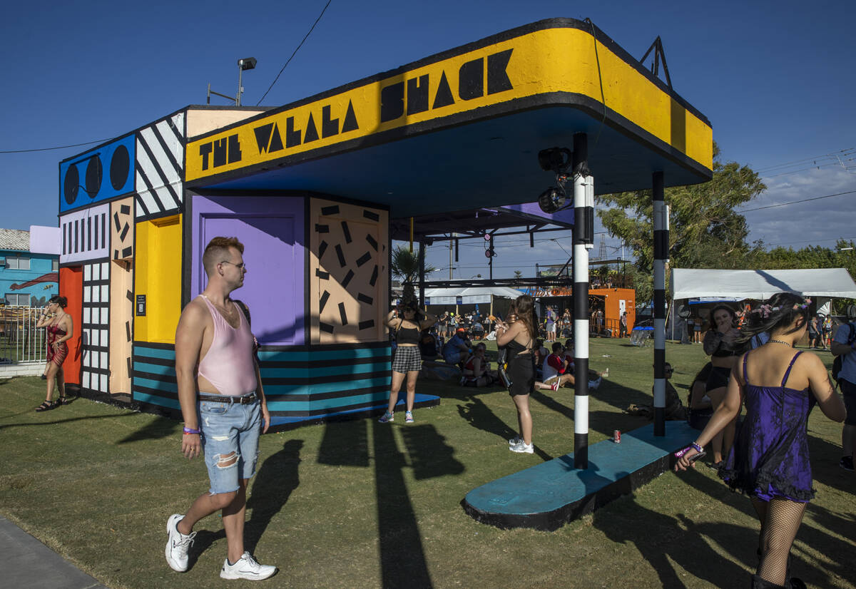 People walk past art by Camille Walala at South 8th and Fremont streets during day two of Life ...