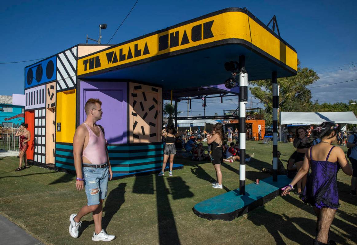 People walk past art by Camille Walala at South 8th and Fremont streets during day two of Life ...