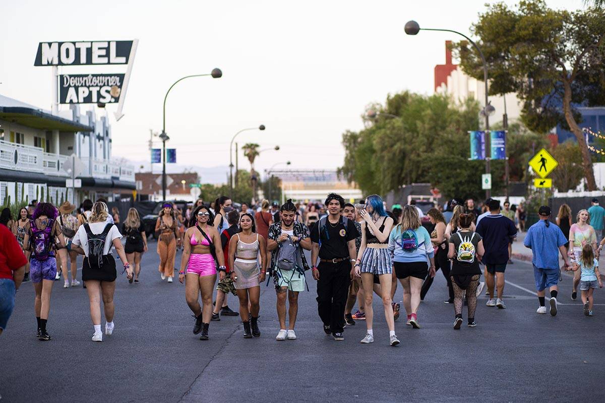 Attendees walk the festival grounds during the final day of the Life is Beautiful festival in d ...
