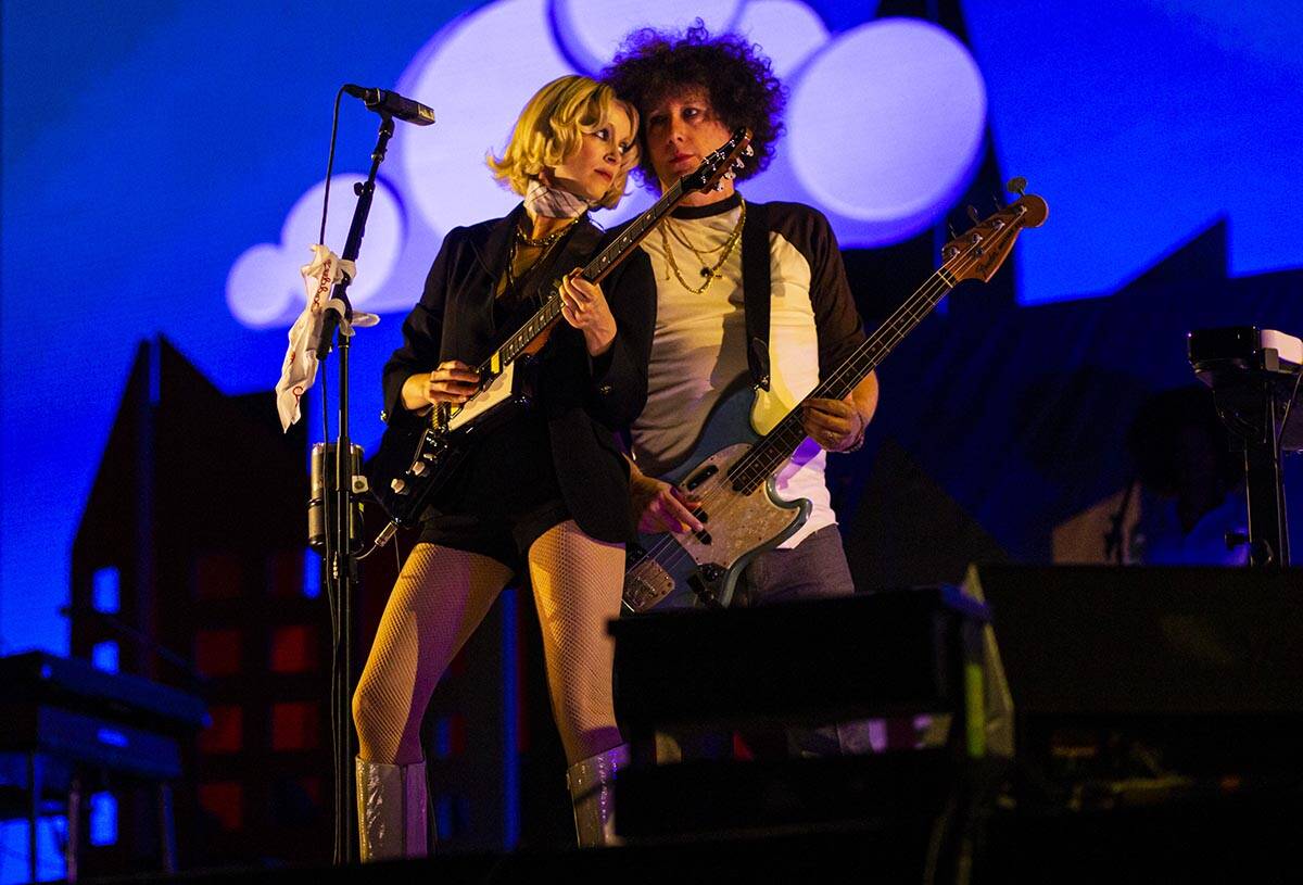 St. Vincent, left, performs with her band at the downtown stage during the final day of the Lif ...
