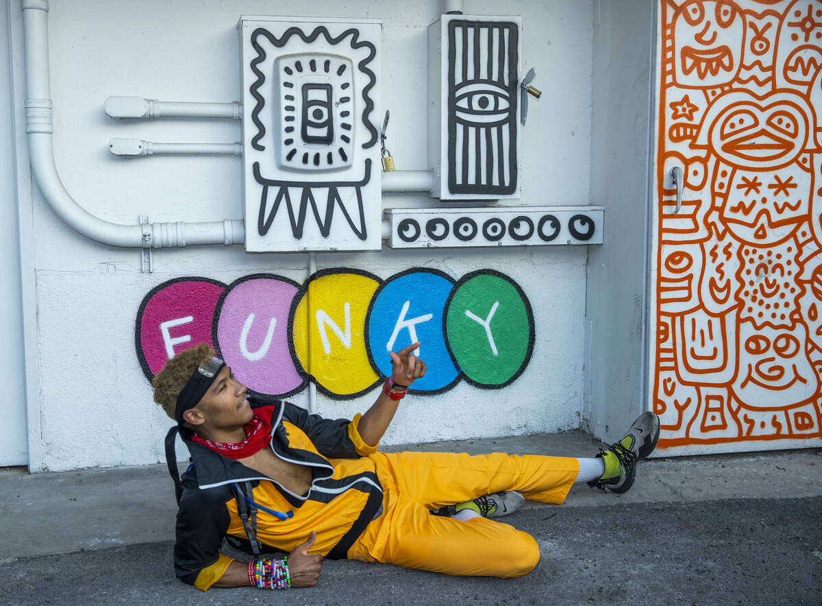 Cameron Conant of Hawaii with some of the fun art along an alleyway between South 7th and 8th s ...