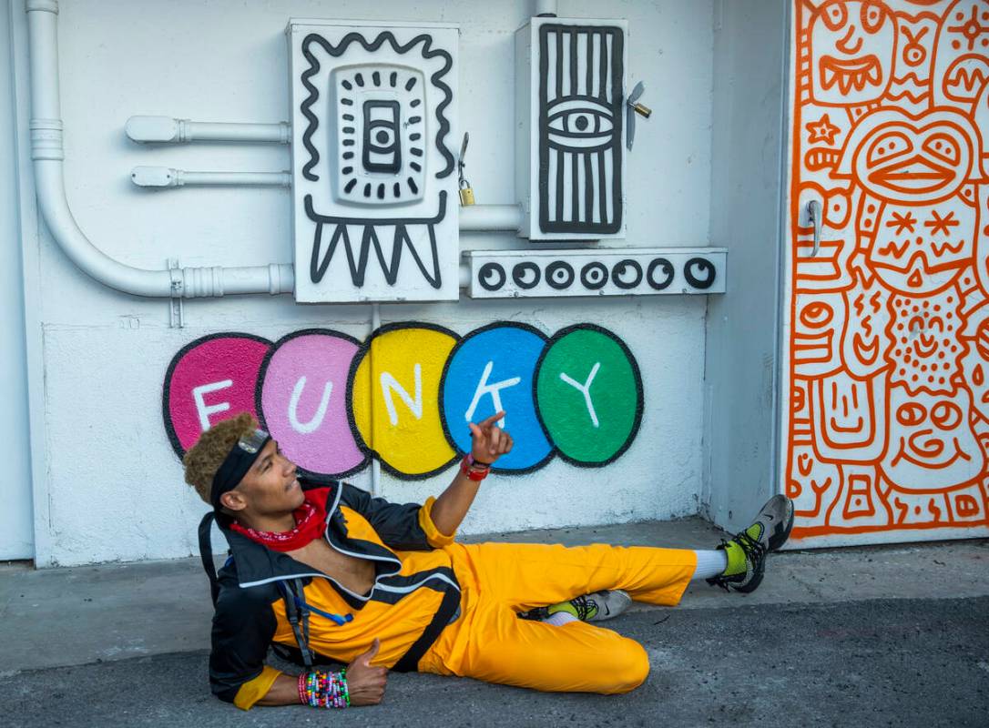 Cameron Conant of Hawaii with some of the fun art along an alleyway between South 7th and 8th s ...