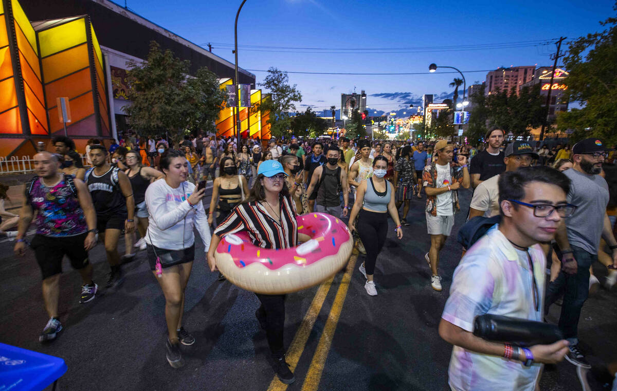 Attendees make their way along Fremont Street to a nearby stage during day one of Life is Beaut ...