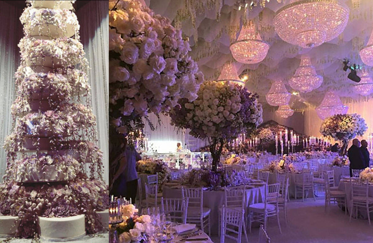 The wedding cake, left, and a lavish floral display are seen at the Kelley Fertitta-Tyler Nemir ...