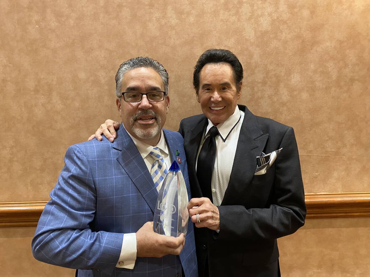 Latin Chamber of Commerce President Peter Guzman and Wayne Newton are shown with Newton's Enter ...