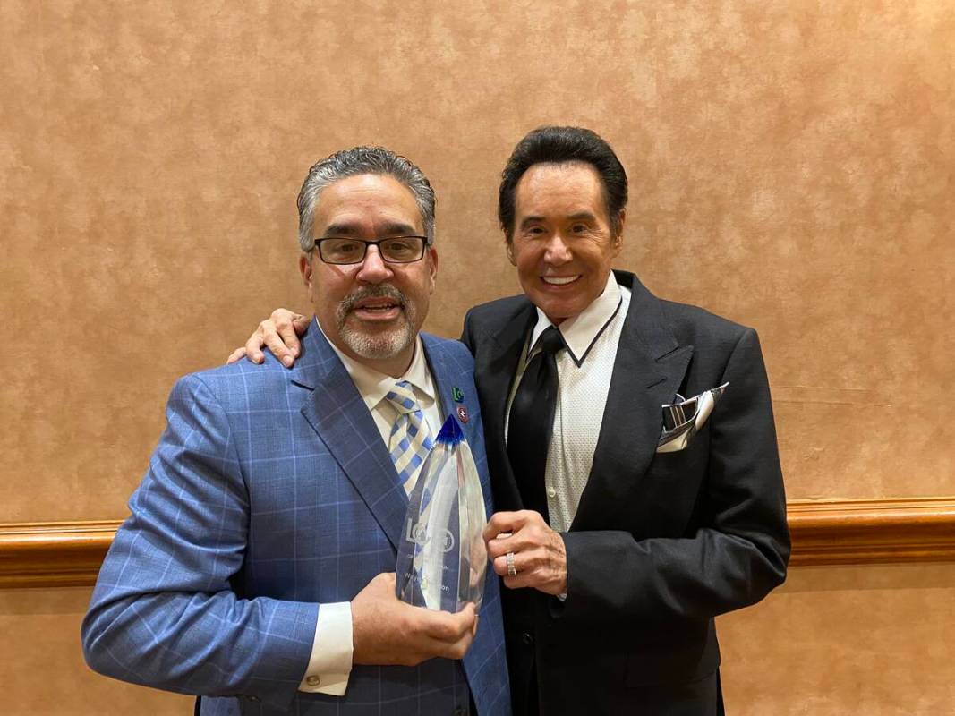 Latin Chamber of Commerce President Peter Guzman and Wayne Newton are shown with Newton's Enter ...