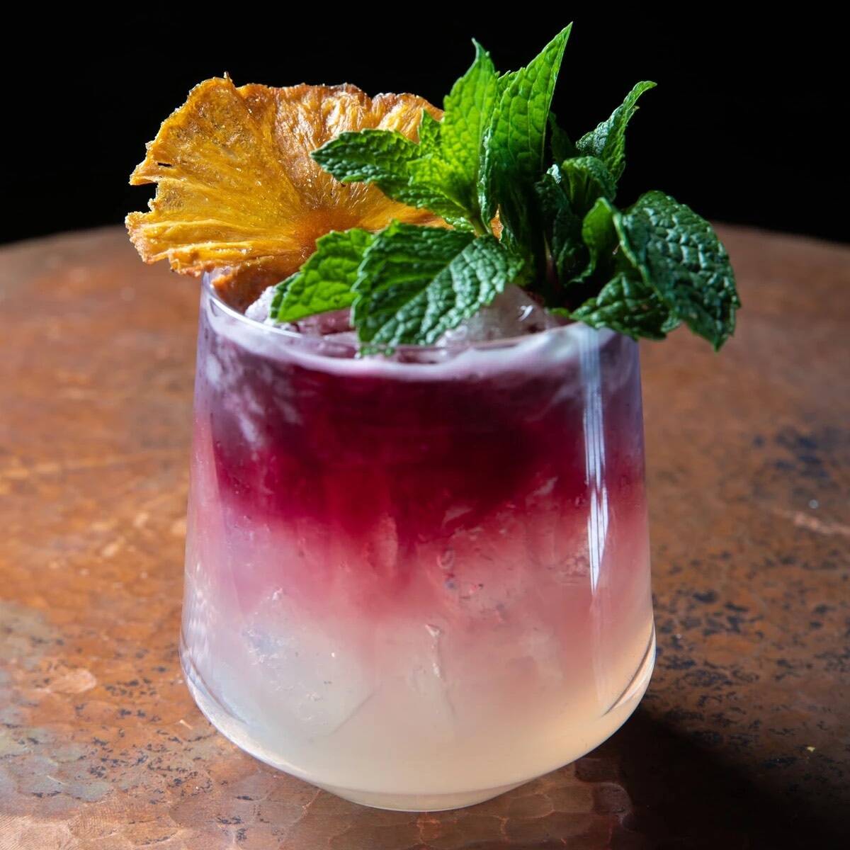 Serenade starts Bacardi Dragonberry, Singani62, passionfruit-basil syrup and lemon with a red w ...
