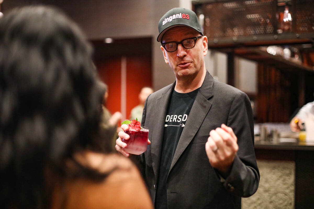 Oscar-winning director Steven Soderbergh talks with a local bartender while promoting the liquo ...