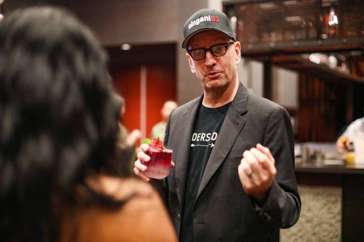 Oscar-winning director Steven Soderbergh talks with a local bartender while promoting the liquo ...