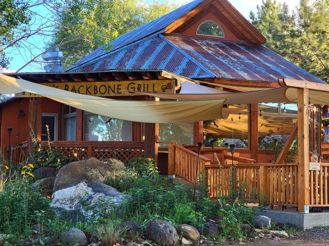 Shade-creating panels partially obscure the name of Hell’s Backbone Grill, an award-winning r ...