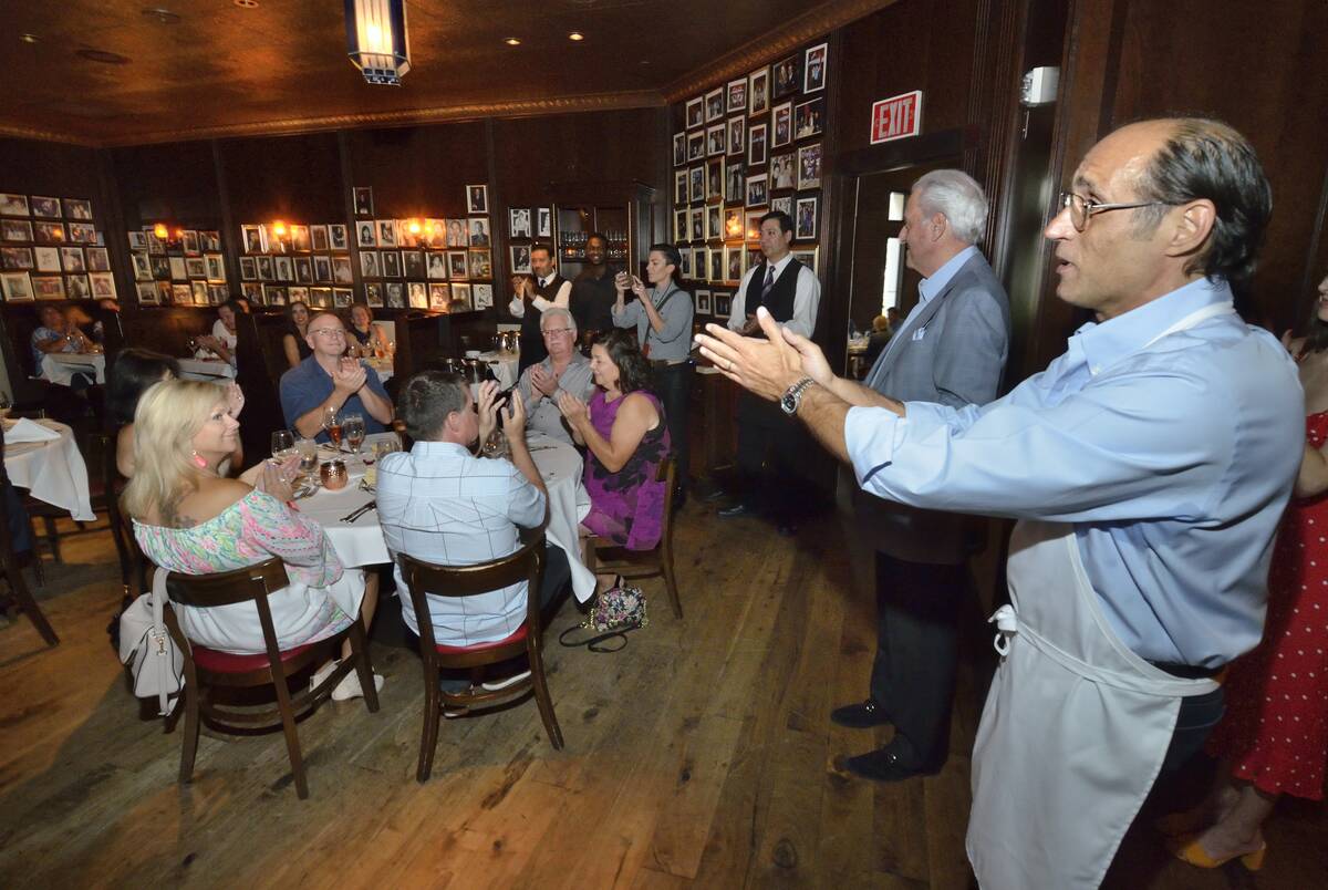 Frank Pellegrino Jr., a partner a Rao’s, left, welcomes guests to his restaurant during Vegas ...