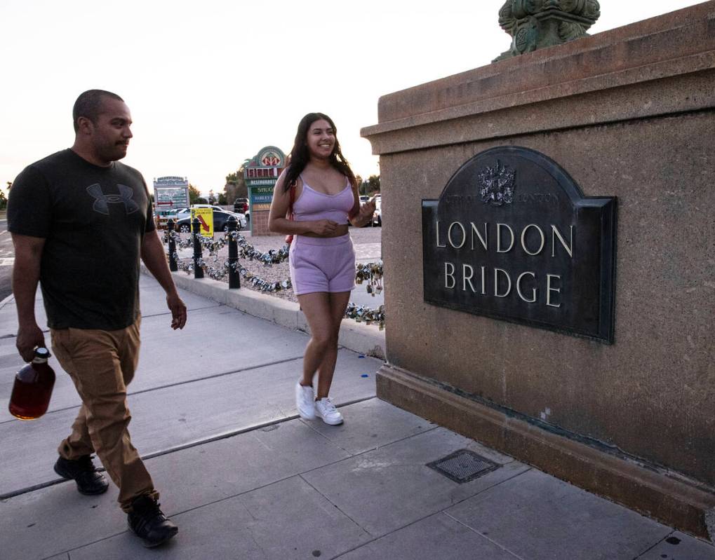 Pedestrians walk across London Bridge on Saturday, Oct. 2, 2021, in Lake Havasu, Ariz. (Bizuaye ...