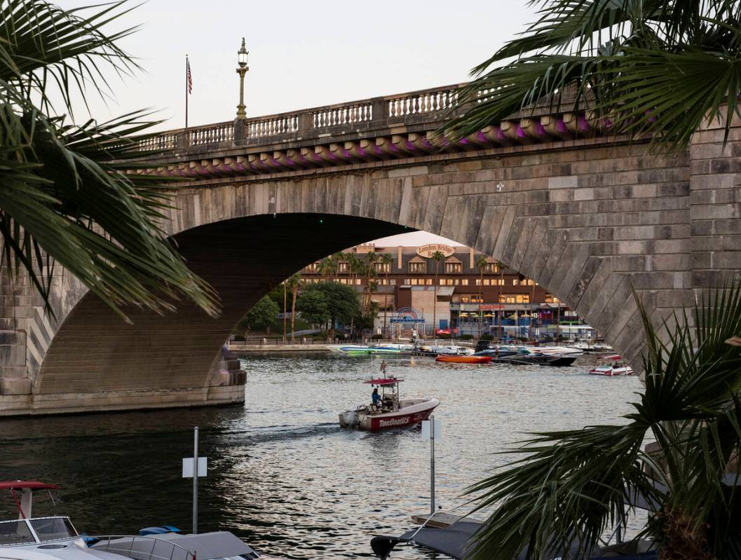 A boat travels under London Bridge on Saturday, Oct. 2, 2021, in Lake Havasu, Ariz. (Bizuayehu ...