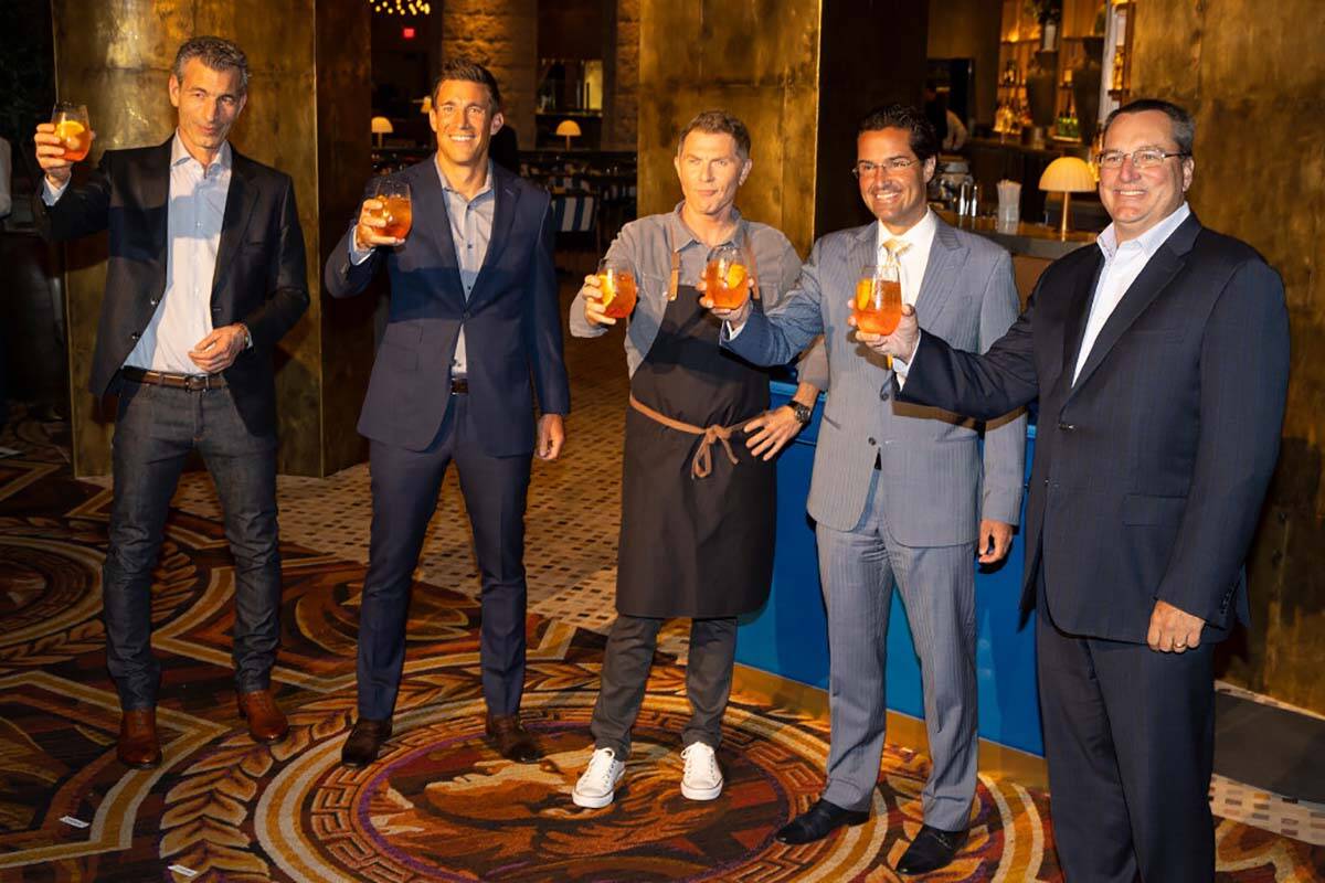 Celebrity chef Bobby Flay, center, with Laurence Kretchmer, from left, managing partner at Bobb ...