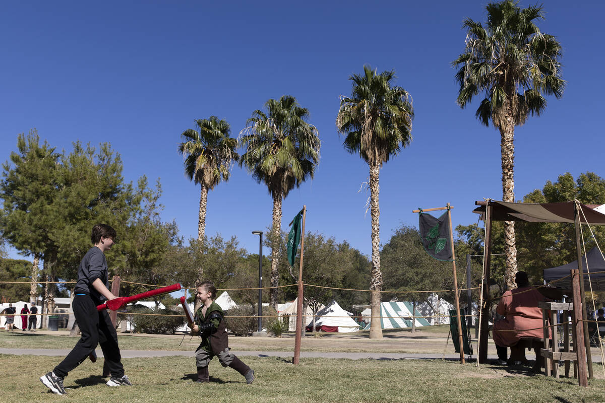 Wayne Halliday, left, 12, and Vincent Rode, 5, participate in a children's jousting competition ...