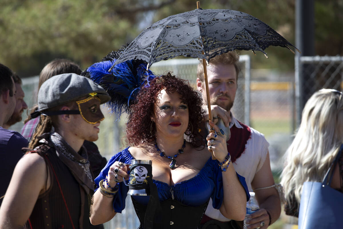 A couple who identified themselves as Lady Lindsey Lee and, center left, and Captain Atticus Bl ...