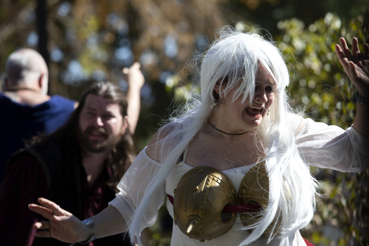 Performers act out mass hysteria during a "ragnarok" production during the Age of Chi ...