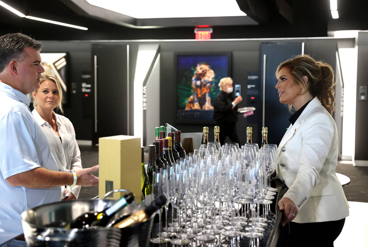 Sandra Taylor, head sommelier at Allegiant Stadium in Las Vegas, right, talks to Daniel Coccia ...