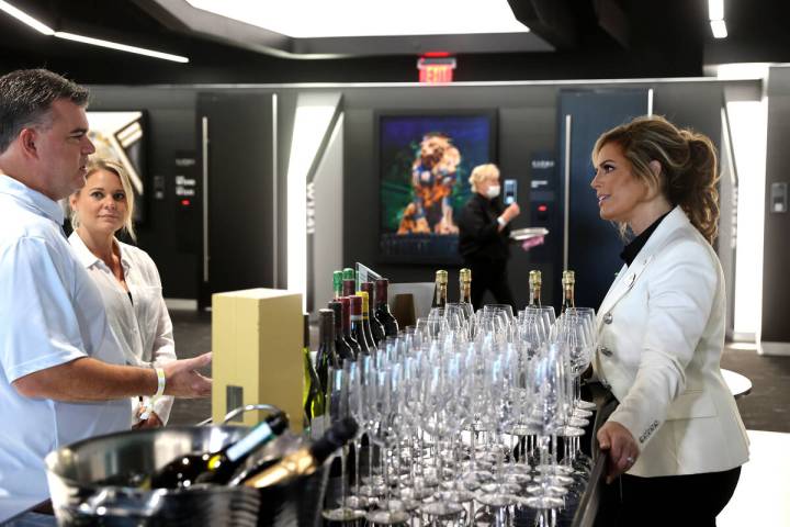 Sandra Taylor, head sommelier at Allegiant Stadium in Las Vegas, right, talks to Daniel Coccia ...