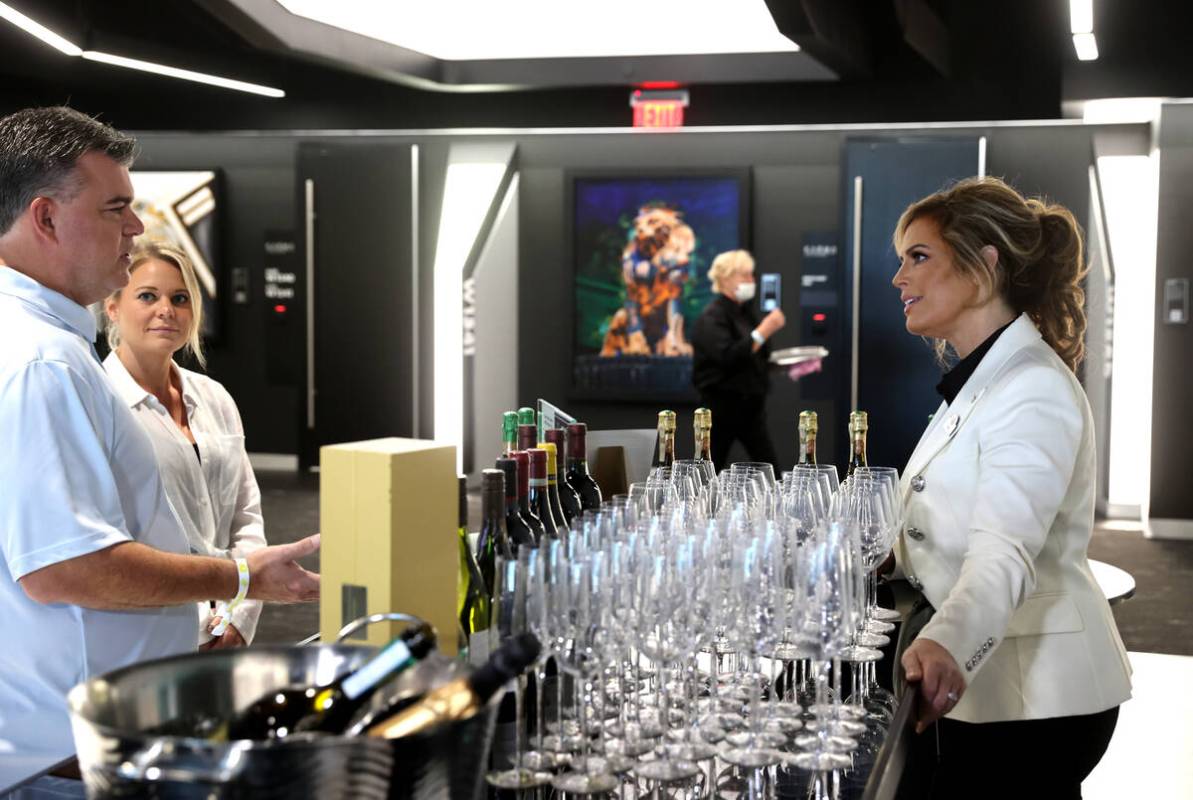 Sandra Taylor, head sommelier at Allegiant Stadium in Las Vegas, right, talks to Daniel Coccia ...