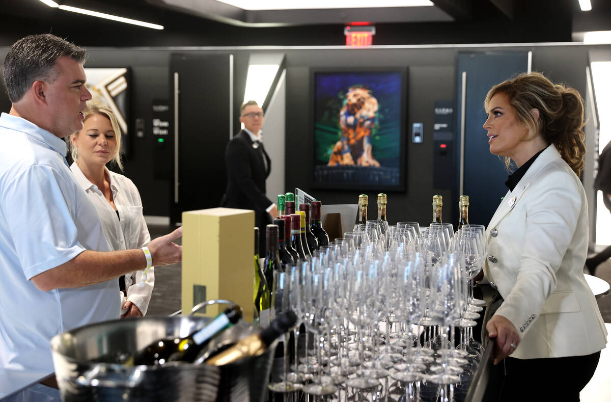 Sandra Taylor, head sommelier at Allegiant Stadium in Las Vegas, right, talks to Daniel Coccia ...