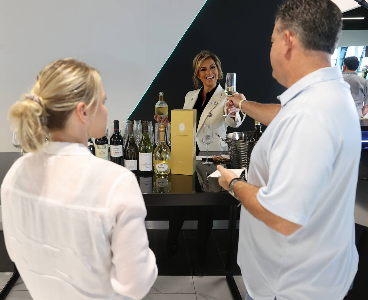Sandra Taylor, head sommelier at Allegiant Stadium in Las Vegas, center, talks to Rachel Chris ...