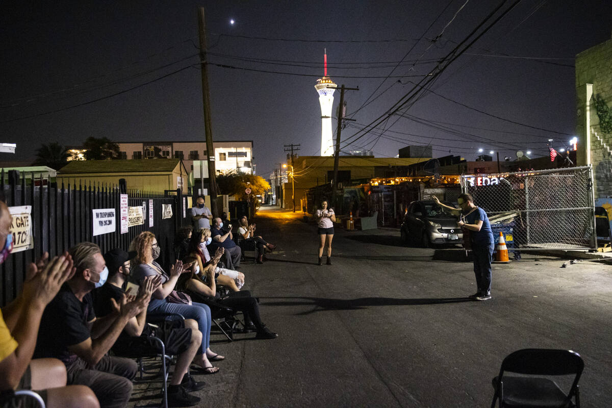 Mike Vargovich, right, performs in an alleyway during a rehearsal for Ҕhe Parking Lot&#x4 ...