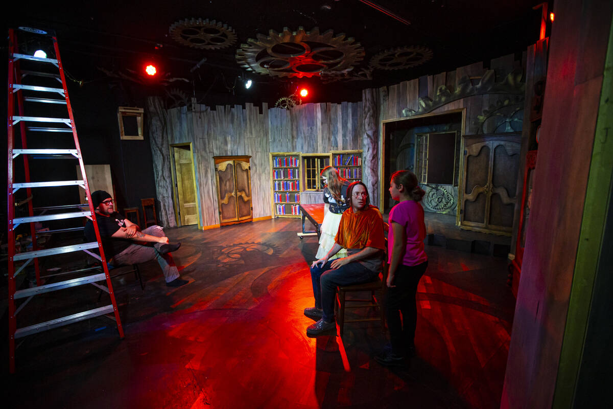 Director Troy Heard, left watches as, from left, Ashlee Grubbs, 16, Steffan Scrogan, and Alora ...