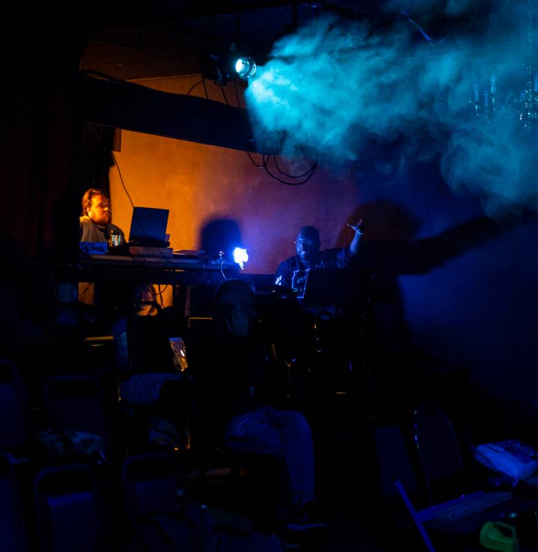Lighting designer Marcus Randolph, right, speaks during a technical rehearsal for Ҕhe San ...