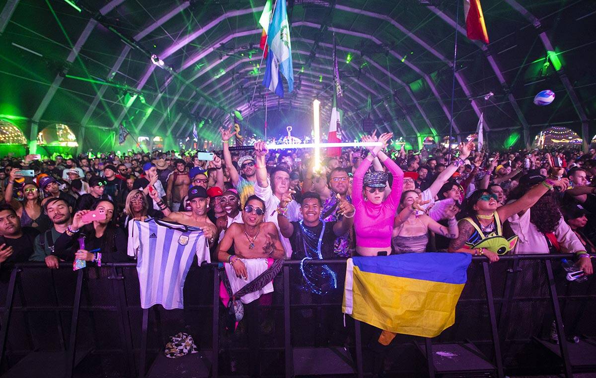 Attendees dance as Artbat performs at the Neon Garden stage during the final day of the Electri ...
