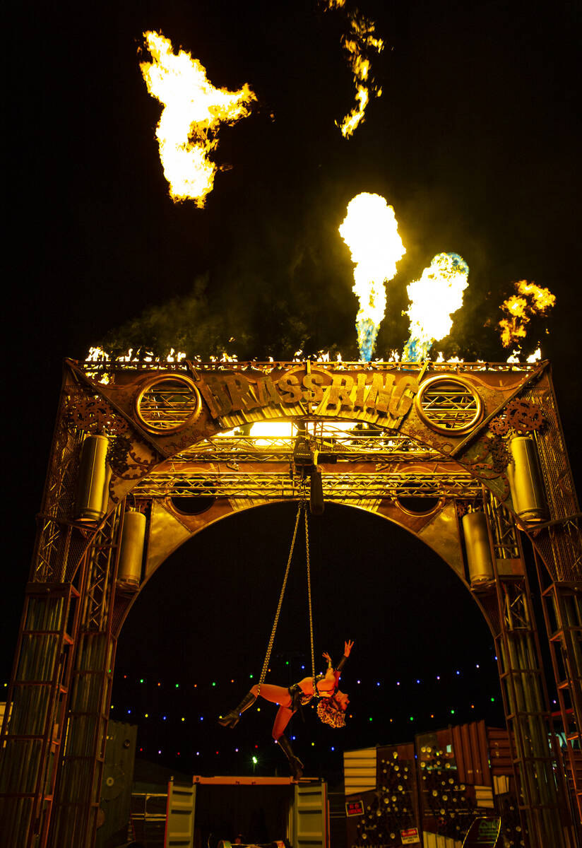 Aerialist Emma Byers performs with chains in Nomads Land during the final day of the Electric D ...