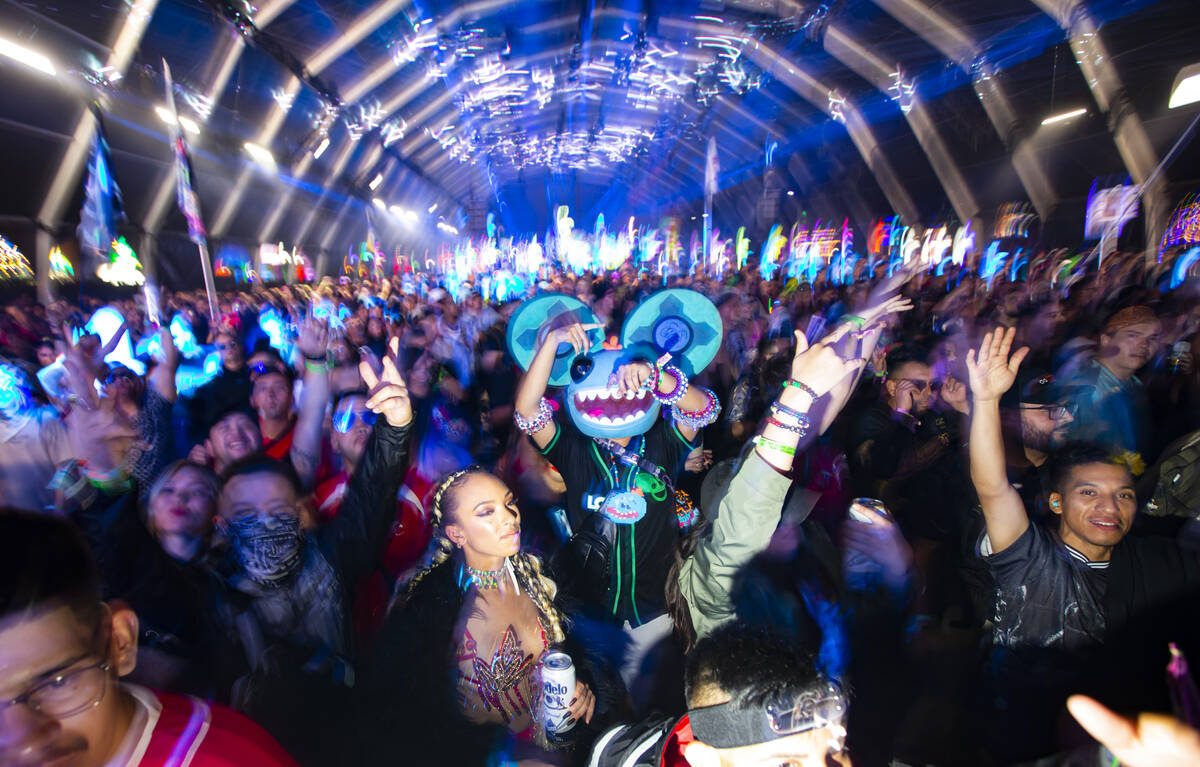 Attendees dance as Enrico Sangiuliano performs at the Neon Garden stage during the Electric Dai ...
