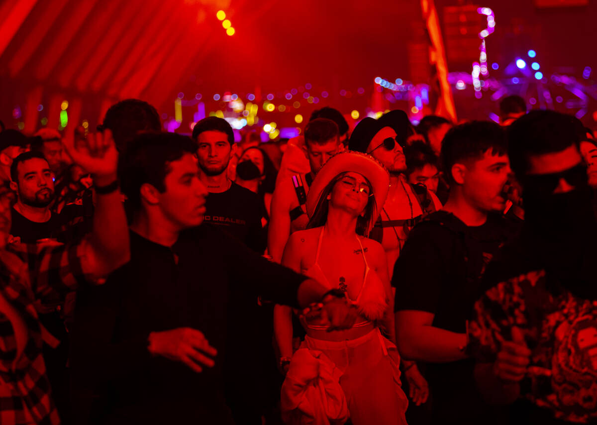 Attendees dance as Enrico Sangiuliano performs at the Neon Garden stage during the Electric Dai ...