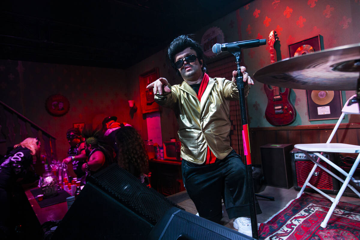 An Elvis tribute artist poses for a picture at the Mini Bar during the Electric Daisy Carnival ...