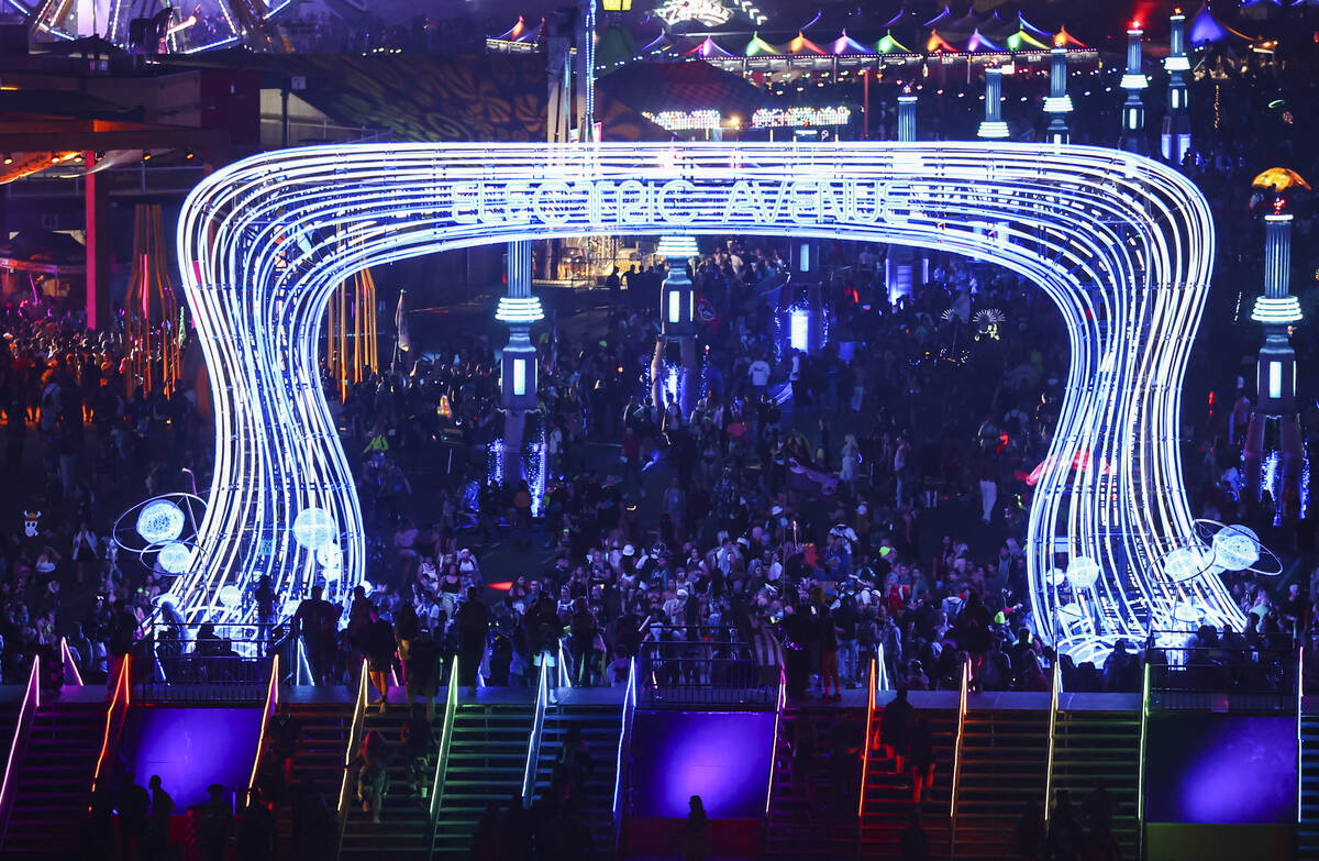Attendees walk along Electric Avenue during the Electric Daisy Carnival at the Las Vegas Motor ...