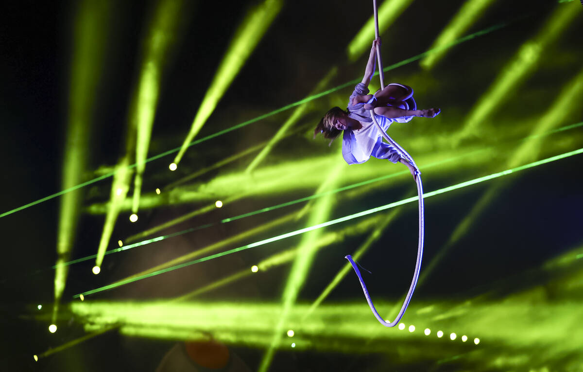 An aerialist performs in Nomads Land entertains the crowd during the second day of the Electric ...