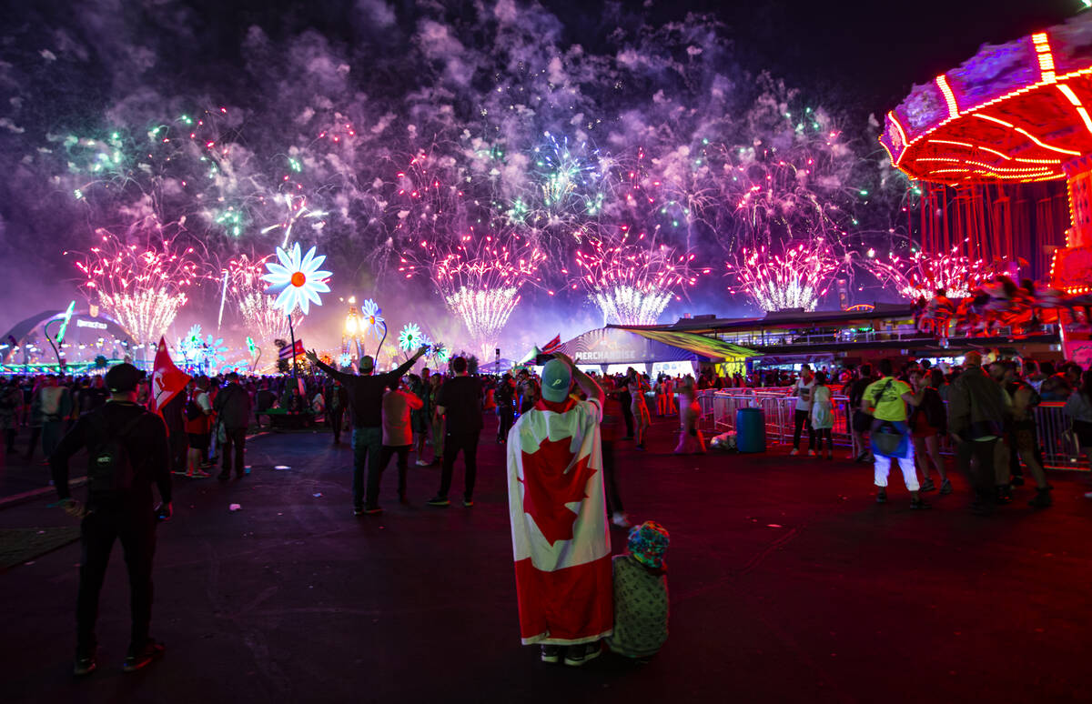 Attendees watch as fireworks go off across the festival grounds during the second day of the El ...