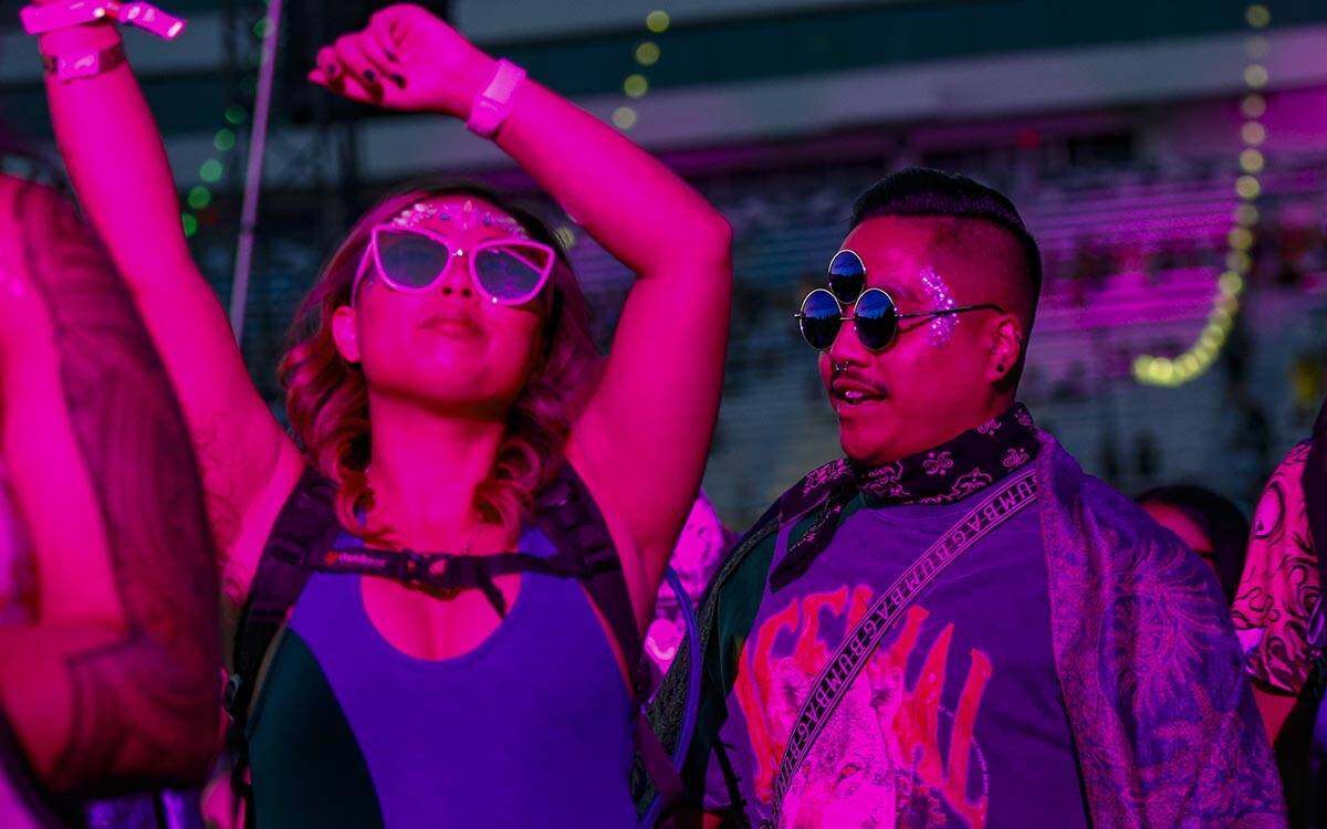 Genesis Sapitan, left, and Jonathan De Leon, both of Long Beach, Calif., dance at the Cosmic Me ...