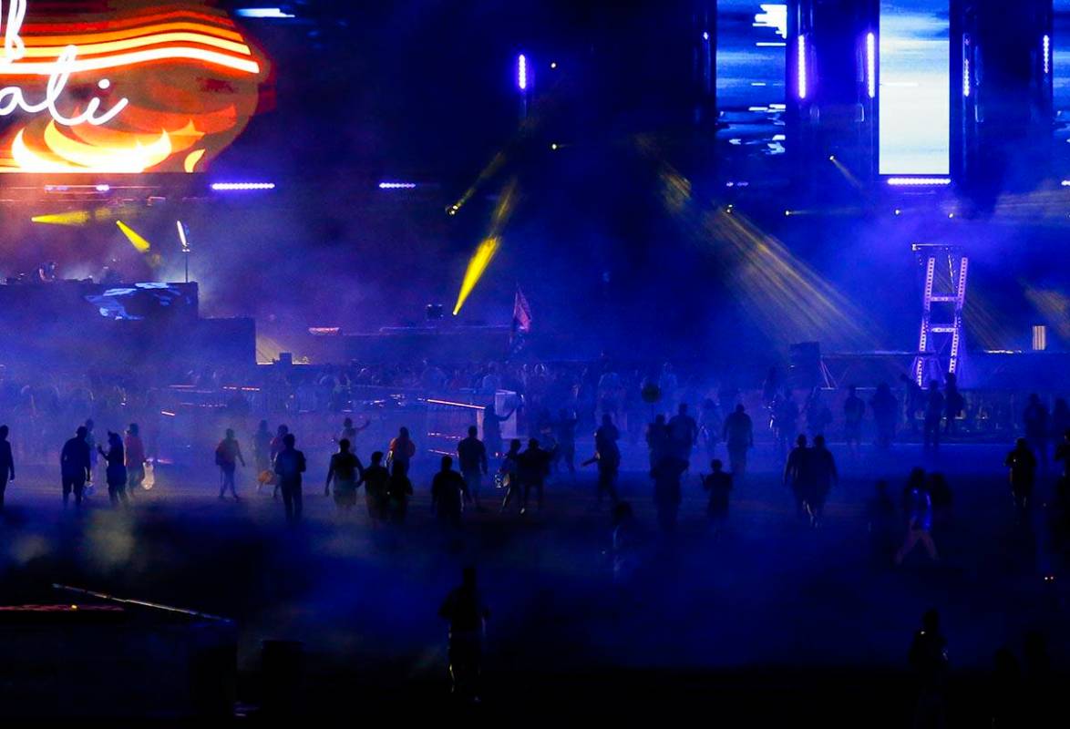 Attendees make their way to the Circuit Grounds stage during the first day of the Electric Dais ...