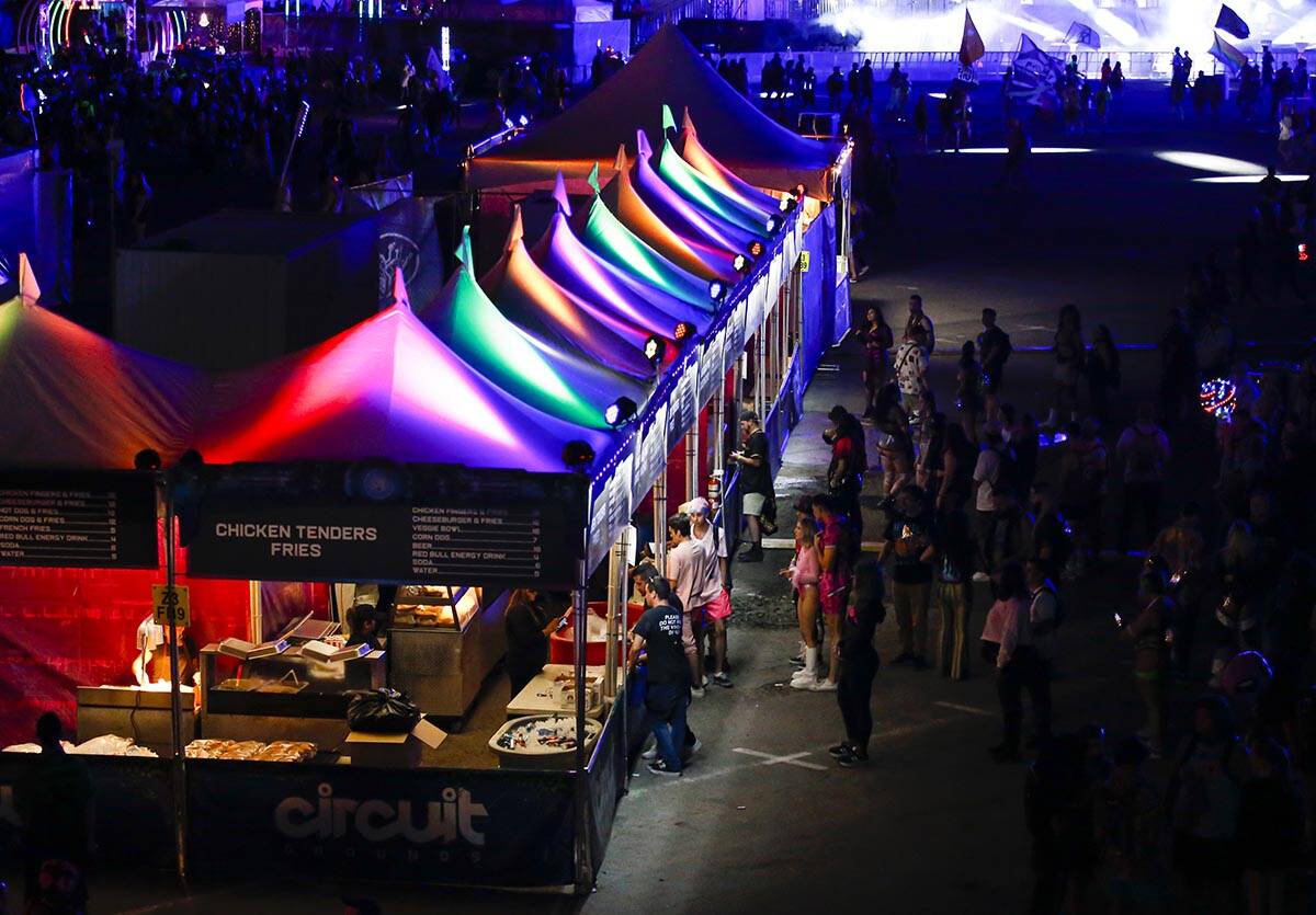 Attendees line up for food vendors during the first day of the Electric Daisy Carnival at the L ...