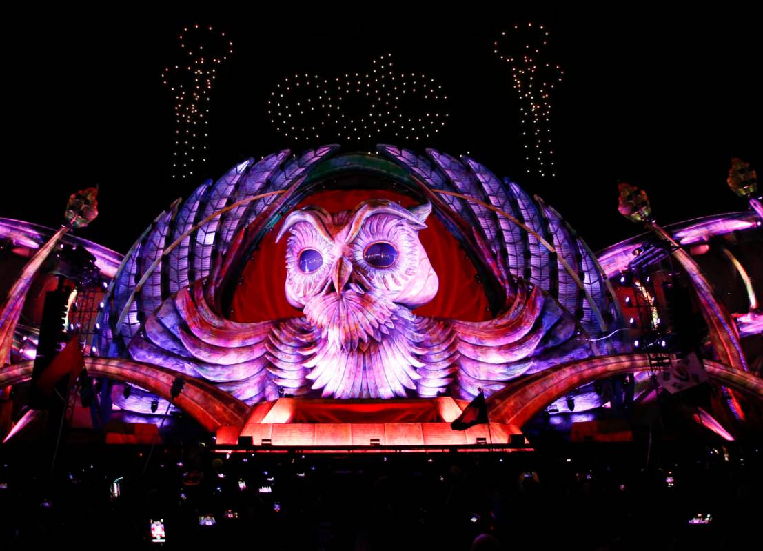Drones light up the sky above the Kinetic Field stage for a 25th anniversary celebration during ...