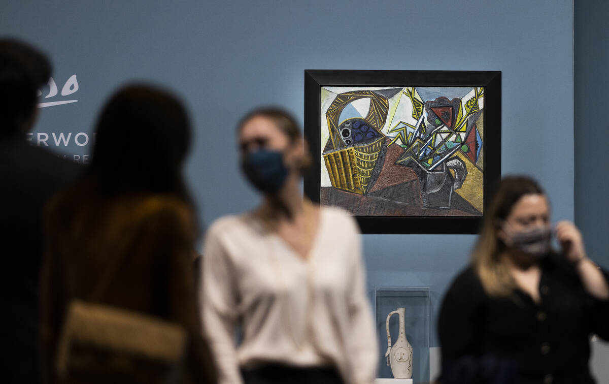 Guests mingle before the start of an auction held by Sotheby's featuring eleven of Pablo Picass ...