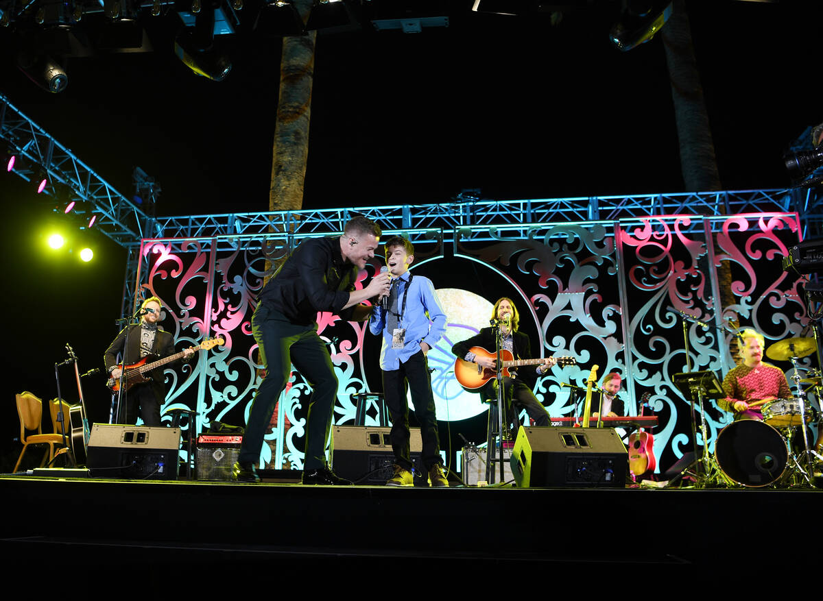 Cooper Sandoval, 12, and Imagine Dragons singer Dan Reynolds perform at Imagine Dragons' sevent ...