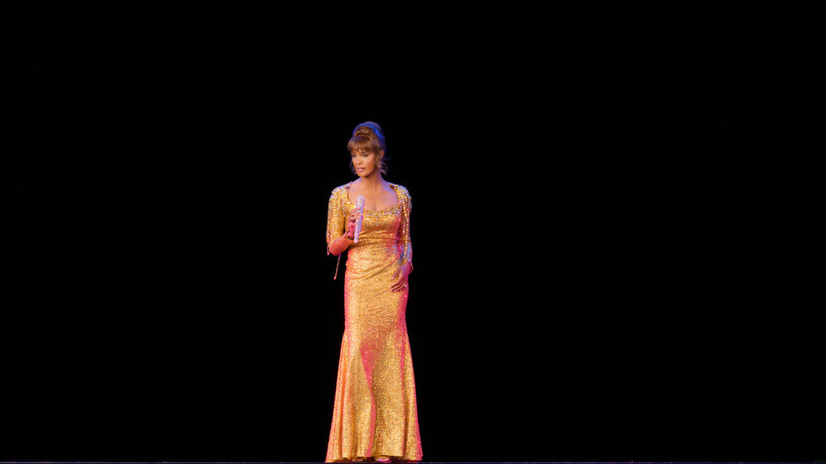 A scene from "An Evening With Whitney: The Whitney Houston Hologram Concert" is shown in this u ...