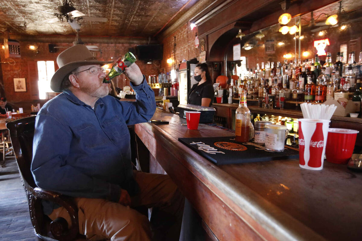 J.P. Palmer of Henderson drinks beer in the Pioneer Saloon, Thursday, Oct. 28, 2021, in Goodspr ...