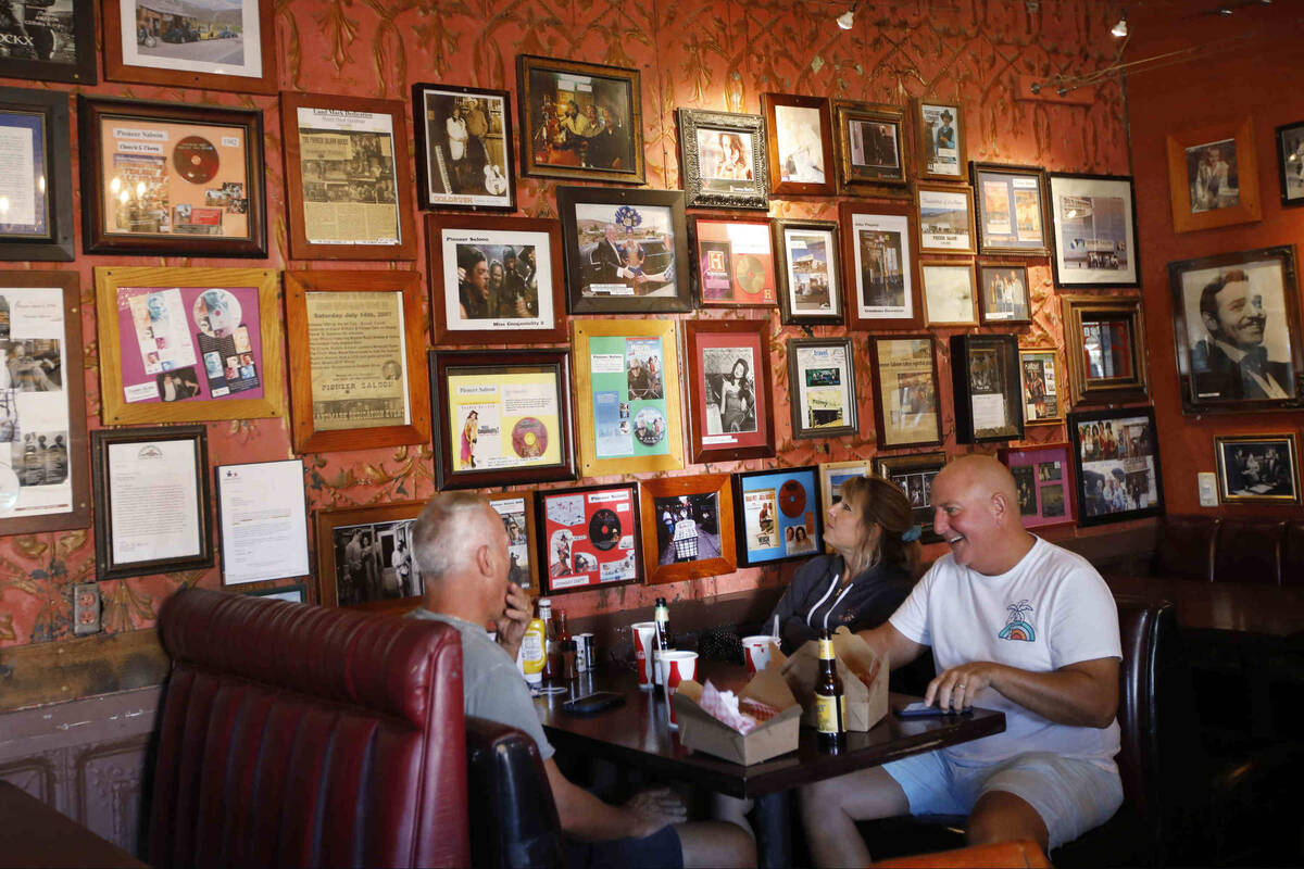 Dave Foster of Las Vegas, left, have lunch with his friends Vincent Gosselin of East Granby, Co ...