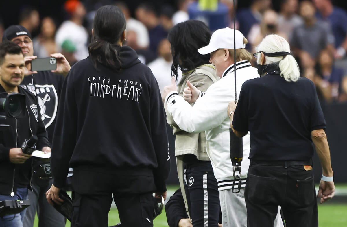 Raiders owner Mark Davis gives thumbs up as magician and "Mindfreak" star Criss Angel ...