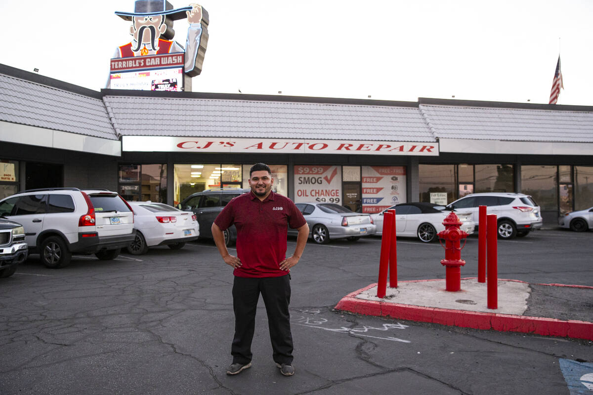 Carlos Sosa, owner and operator at the family-run CJ's Auto Repair shop, poses for a portrait n ...