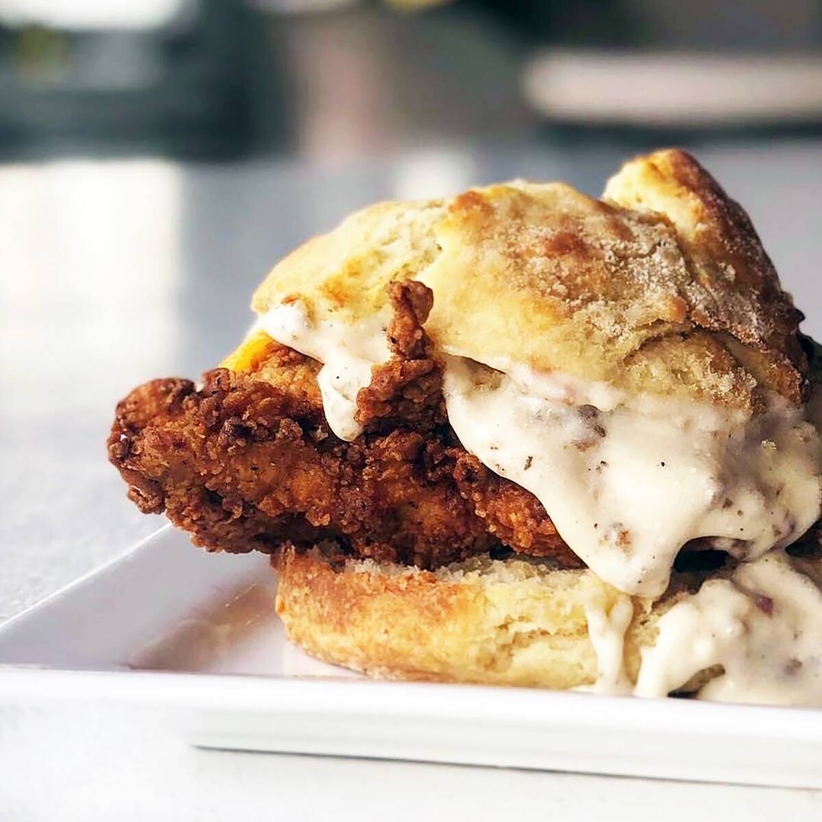 Fried chicken biscuit with gravy. (Nellie's Southern Kitchen)